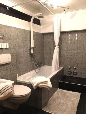 Combined shower/tub, hair dryer, towels, toilet paper