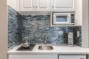 Fridge, microwave, coffee/tea maker, toaster