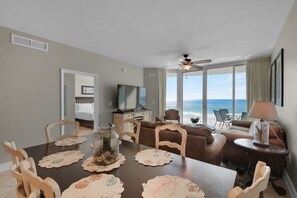 Enjoy a comfortable stay with a large bed, flat-screen TV, and ocean views from the spacious seating area.