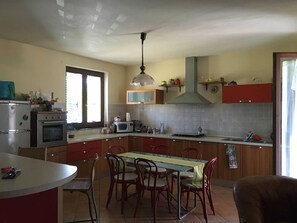 Villa | Private kitchen | Fridge, microwave, oven, stovetop