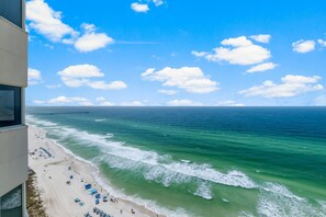 A beach view from a high-rise building with a pier in the distance. - BEAUTIFUL BEACHFRONT! 2BDS/2BTHS!! BCH SRVC INCL!!! (Panama City Beach)
