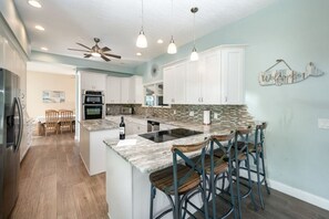 Fridge, microwave, oven, stovetop - Waterfront Beauty: Sleeps 15, Heated Pool, Private Dock, Near Beach (Merritt Island)