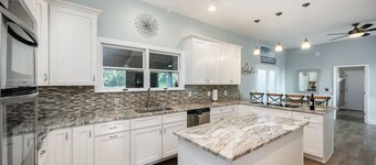 Waterfront Beauty: Sleeps 15, Heated Pool, Private Dock, Near Beach