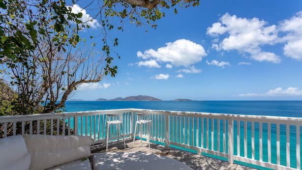 A deck with white furniture, a white railing, and a view of the ocean. - CLIFF HOUSE ONE - SUMMER DISCOUNT, 2 min walk to 2 beaches, surf & restaurants (West End)