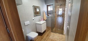 Apartamento família | Banheiro | Toalhas de banho 