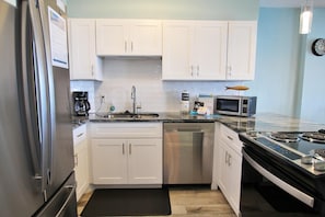 Condo, Multiple Beds (Compass Point 205) | Private kitchen | Cookware/dishes/utensils