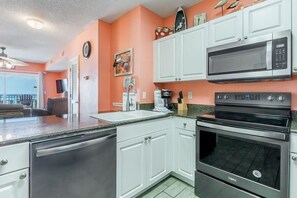 Condo, Multiple Beds (Legacy 102) | Private kitchen | Cookware/dishes/utensils