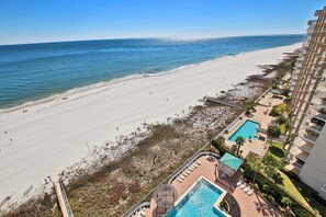 Enjoy a refreshing dip in the pool or relax on a lounge chair with a view of the ocean.
