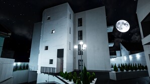A modern building with a courtyard, a large moon in the sky, and a street lamp. - Intercity Residence - Private apartments (Cluj-Napoca)