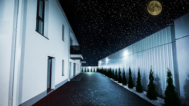 A nighttime scene with a clear sky, stars, and a full moon. - Intercity Residence - Private apartments (Cluj-Napoca)