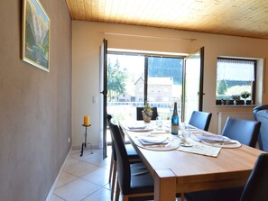 Enjoy meals in this cozy dining area with a view of the surrounding landscape.