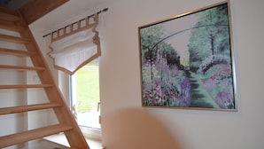 A staircase with wooden steps leading to a landing.