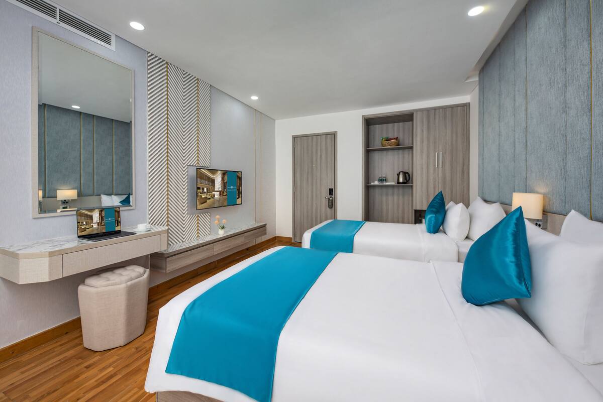 Deluxe Twin Room, City View | Minibar, in-room safe, desk, laptop workspace