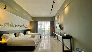 A modern hotel room with two beds, a desk, a TV, and a cityscape mural on the wall.