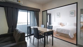 Family Twin Room | Living area | Flat-screen TV