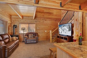 Chalet (3 Bedrooms) | Living area | Flat-screen TV, toys