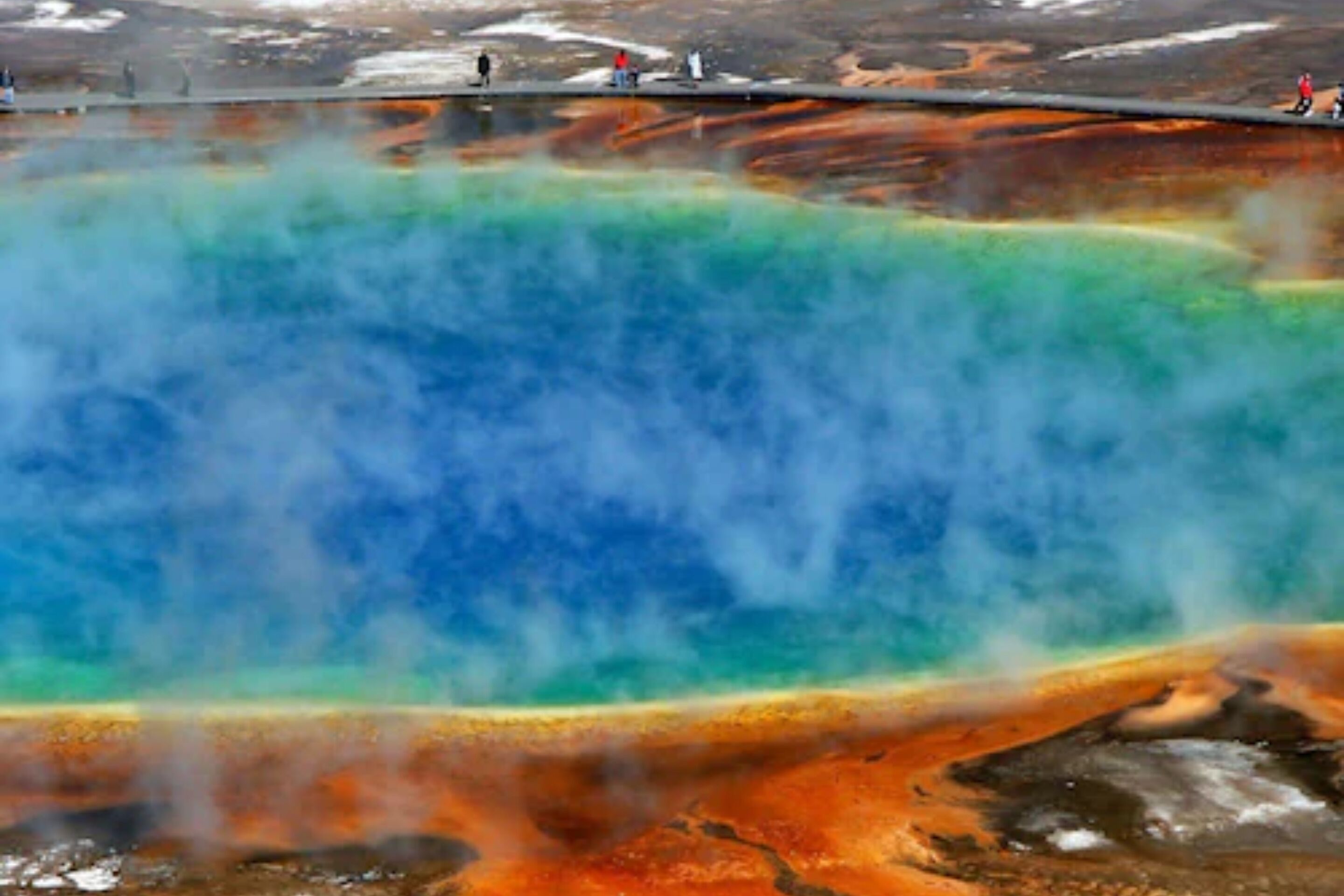 A geothermal hot spring with a viewing platform.
