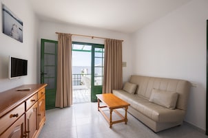 Standard Apartment, 1 Bedroom | Living area | 21-inch LCD TV with satellite channels, TV