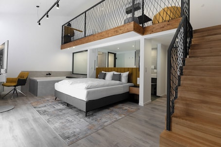 Junior Suite, Jetted Tub | Down comforters, in-room safe, desk, blackout drapes