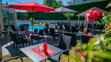 Breakfast, dinner served; international cuisine, pool views