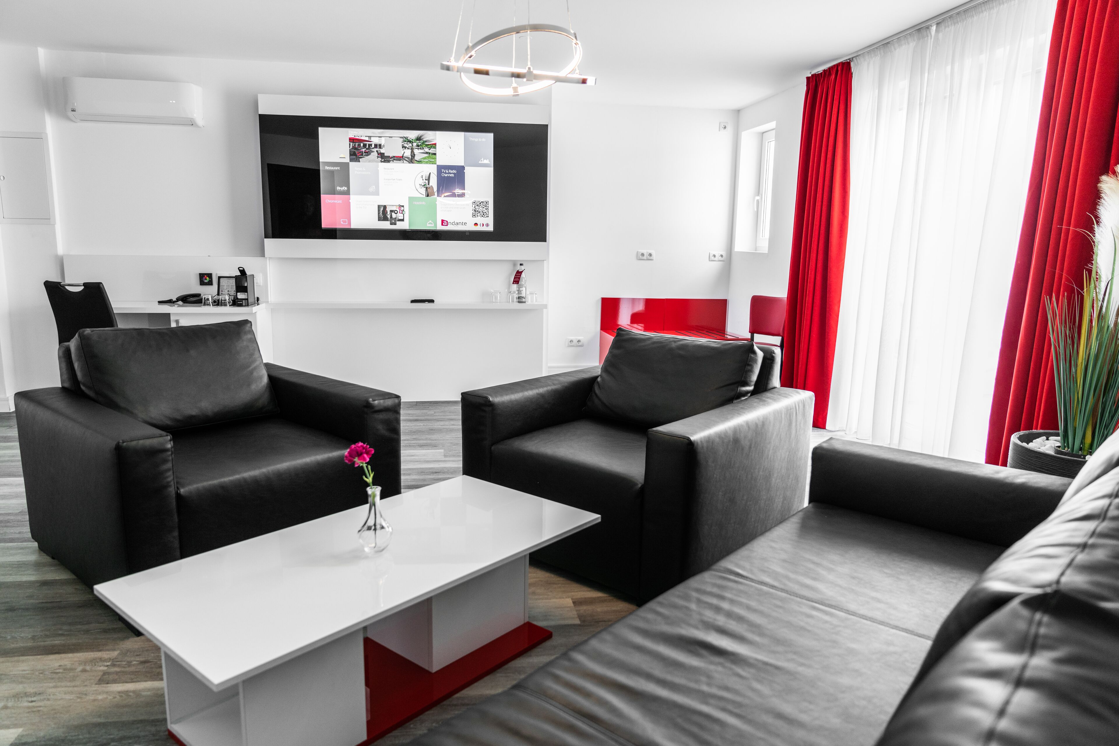 deluxe suite | living area | 55-inch flat-screen tv with satellite channels, tv