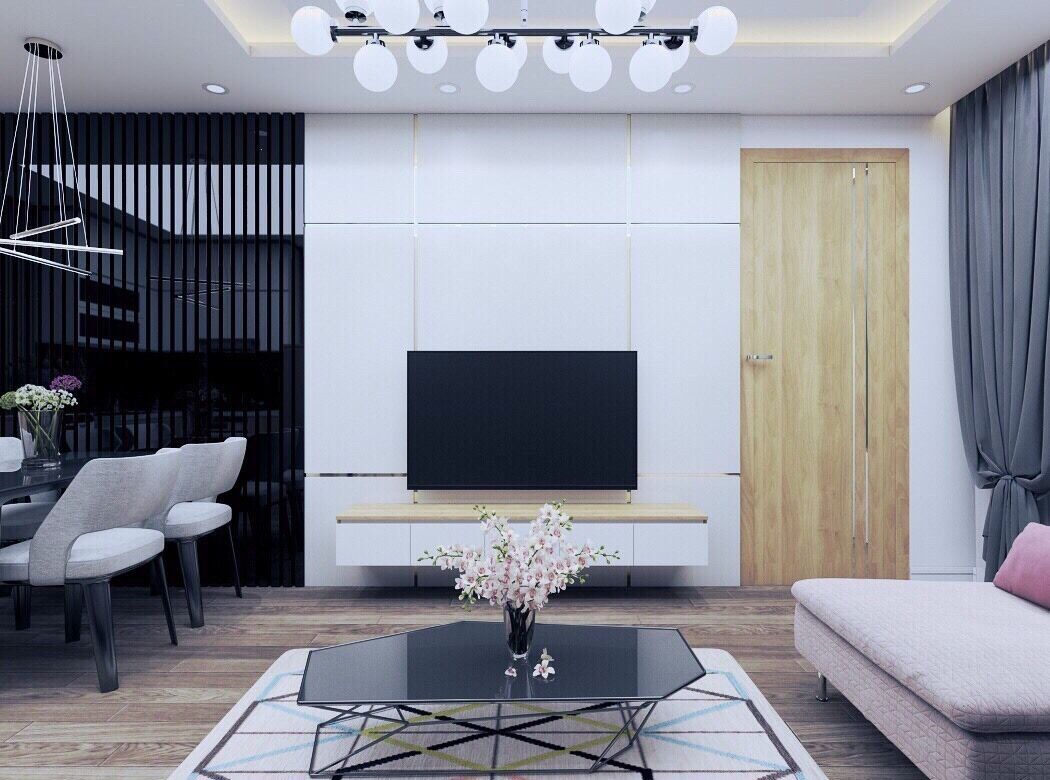 Una sala de estar moderna con un televisor de pantalla plana, una mesa de comedor con sillas, un sofá y una mesa de centro con un jarrón de flores.