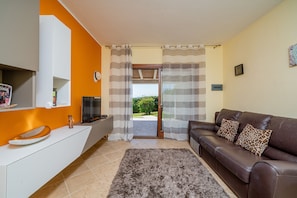 Apartment, 2 Bedrooms | Living area | Flat-screen TV