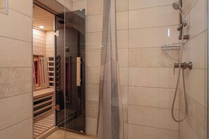 Shower, hair dryer, towels, toilet paper