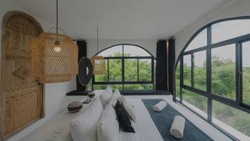 Two-Bedroom Apartment with Partial Ocean View | Premium bedding, pillow-top beds, minibar, in-room safe