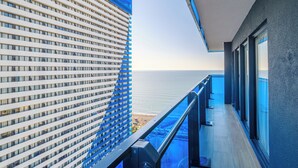 A modern building with a balcony overlooking a beach. - Orbi City Hotel Official (Batumi)