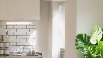 Fridge, microwave, stovetop, cookware/dishes/utensils