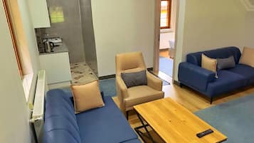 Deluxe villa | Nappali | Síkképernyős tévé