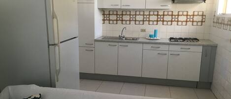 Apartment, 1 Bedroom | Private kitchenette | Fridge, microwave, stovetop, coffee/tea maker