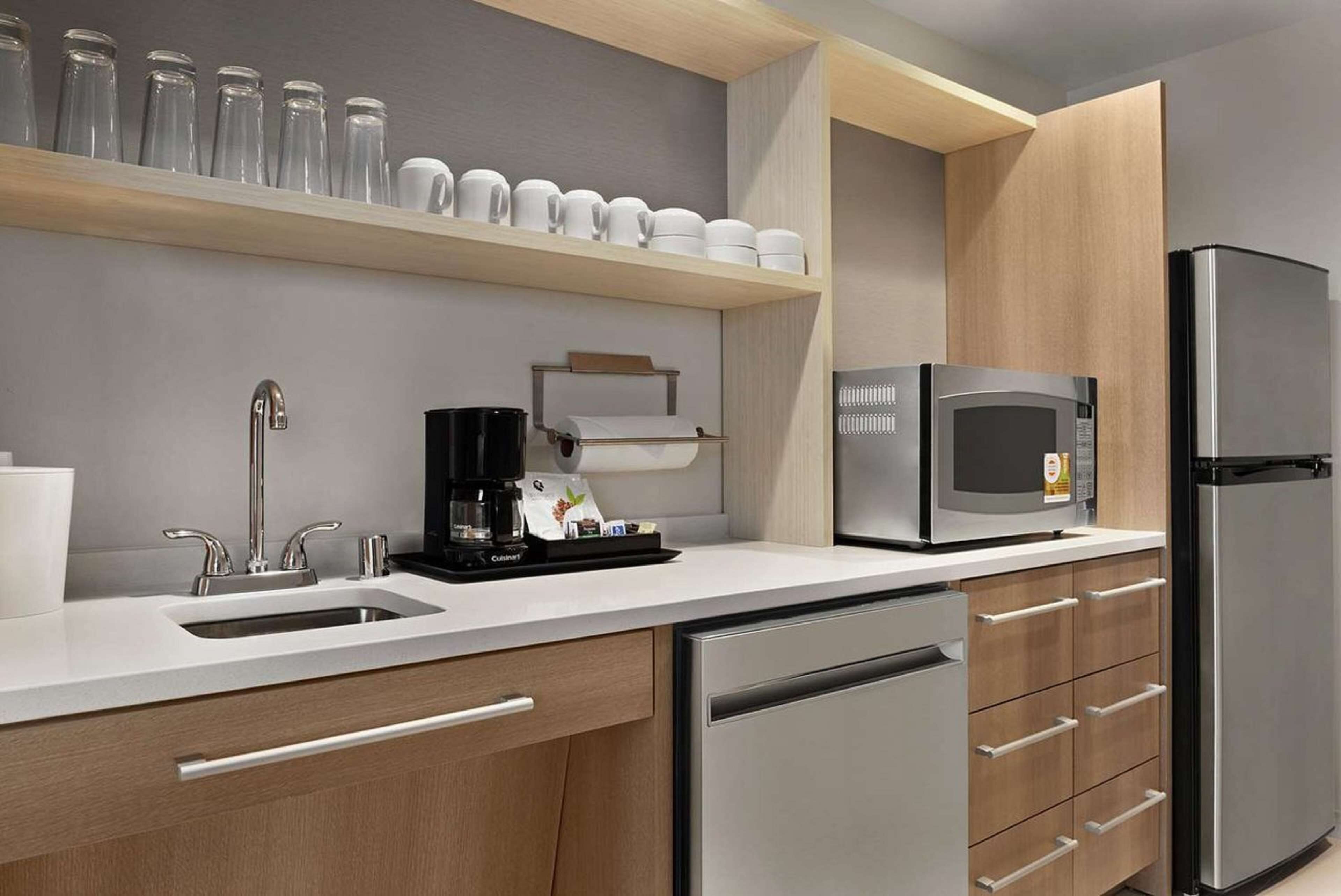 full-sized fridge, microwave, stovetop, dishwasher