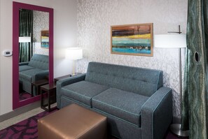 Desk, laptop workspace, iron/ironing board, bed sheets