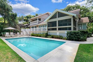 A heated pool, pool loungers