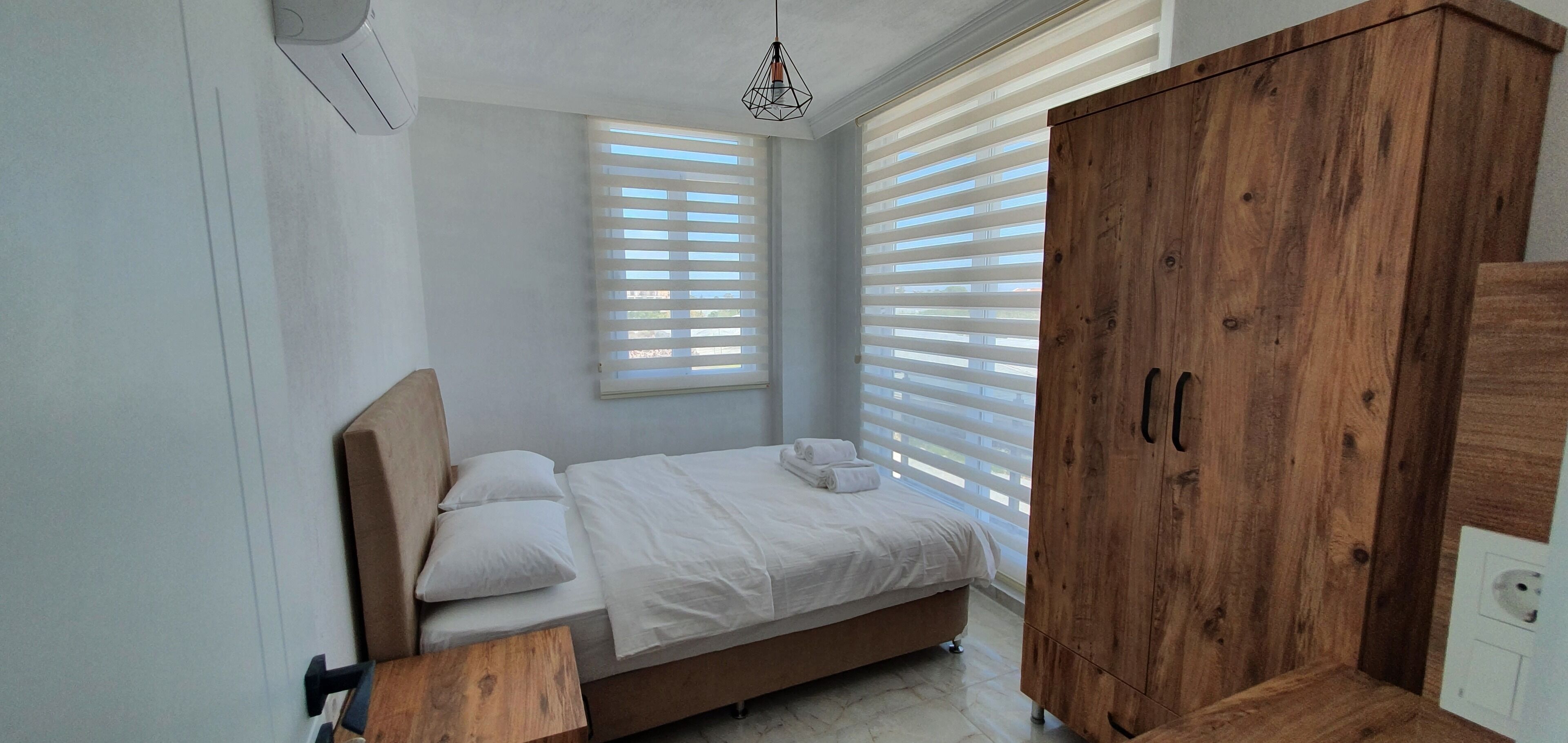 Premium bedding, desk, laptop workspace, soundproofing