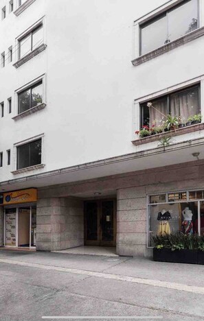 Stylish building with a flat facade and storefront.