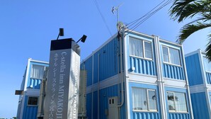 A building with a sign indicating it is the C-stella inn Miyakojima.