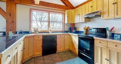 Spectacular lakefront home with dock, firepit, & vaulted ceilings - dog-friendly