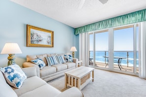 Relax by the sea with a comfortable sofa set and a beautiful coastal view.