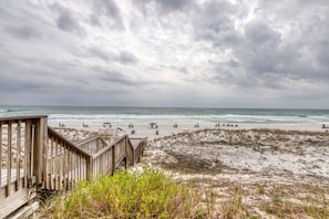 Guests can relax on the beach with access to comfortable chairs and umbrellas.