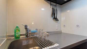 Fridge, microwave, stovetop, cookware/dishes/utensils