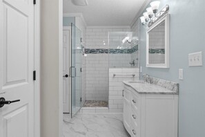 Bathtub, hair dryer, towels, soap