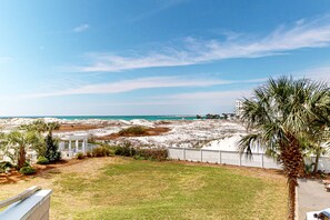 Enjoy breathtaking views of the sea from this serene coastal retreat, surrounded by a palm tree and a charming gazebo.