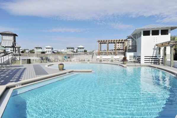 Relax by the rectangular pool surrounded by a deck and a shaded gazebo.