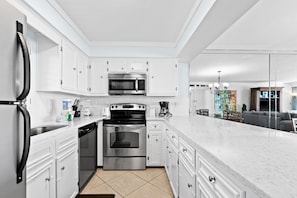 Enjoy cooking in this well-equipped kitchen with a dishwasher, oven, microwave, coffee maker, and toaster.