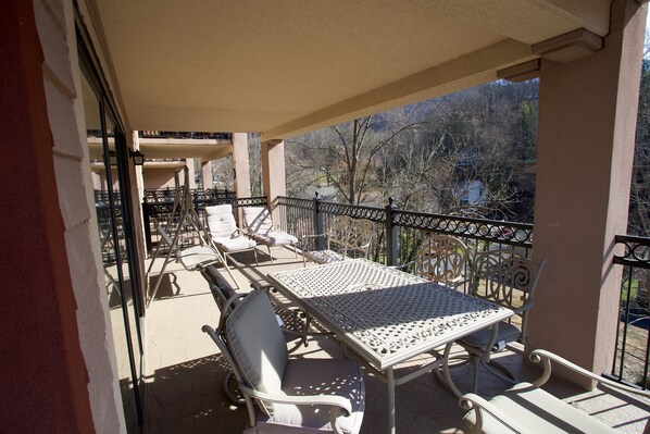 Outdoor dining - Convenient Creekside condo with large wrap around balcony, close to everything! (Gatlinburg)