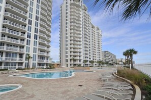 Enjoy a refreshing dip in the pool surrounded by comfortable lounge chairs.