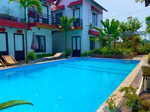 Outdoor pool, open 7:00 AM to 10:00 PM, free pool cabanas, pool loungers